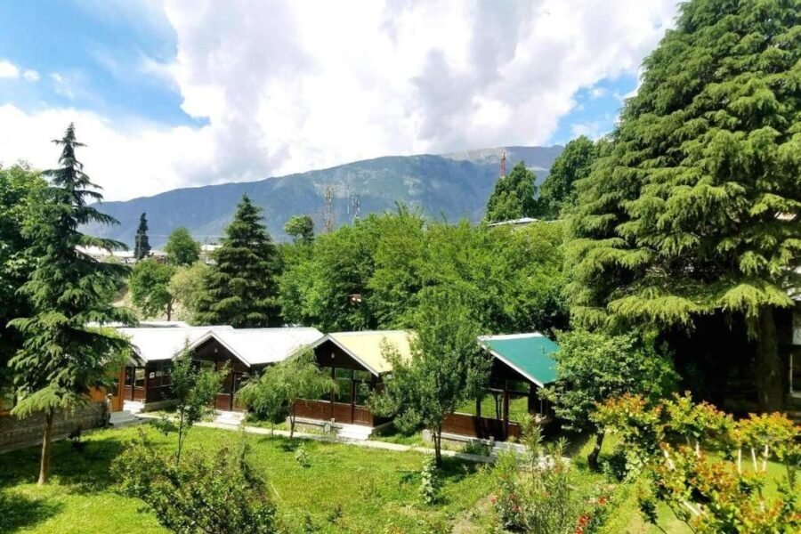 mountain inn hotel chitral covered in hills
